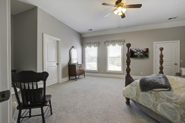bedroom featuring light carpet, baseboards, visible vents, and a ceiling fan