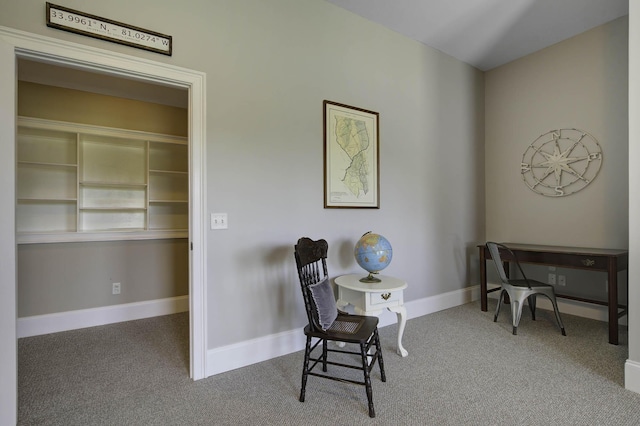 carpeted office featuring baseboards