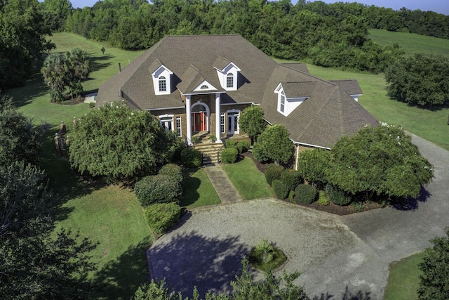 birds eye view of property featuring a wooded view