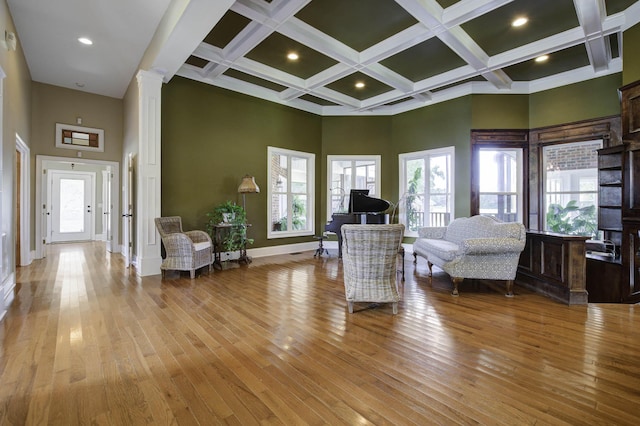interior space with a high ceiling and wood-type flooring