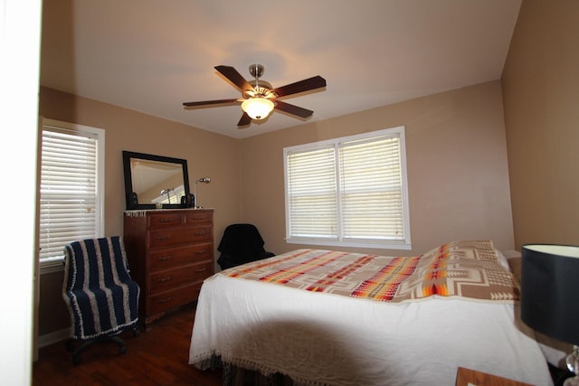 bedroom featuring dark wood-type flooring and a ceiling fan