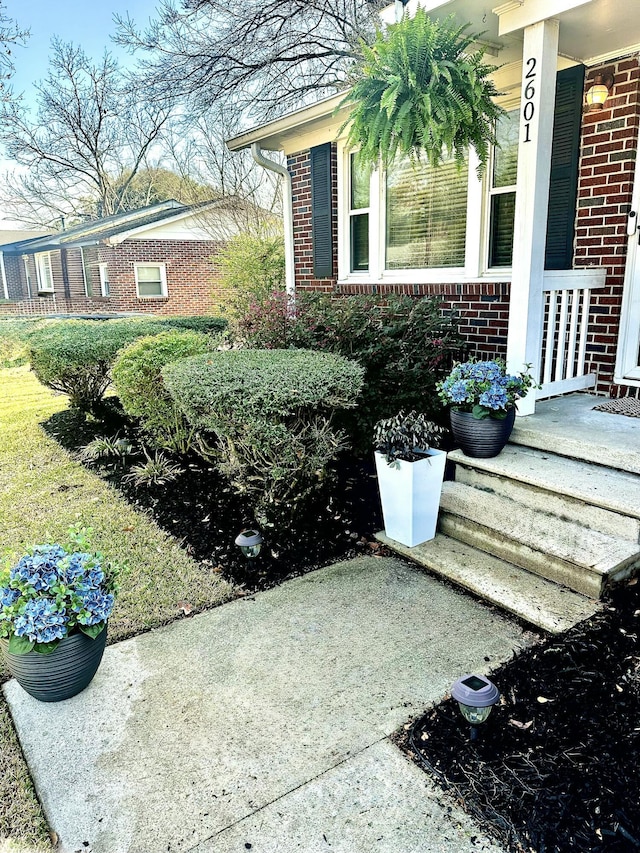 view of side of home featuring brick siding