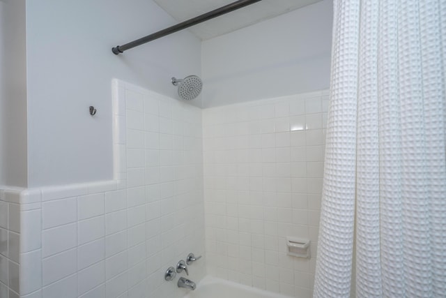 full bathroom with shower / bath combo with shower curtain