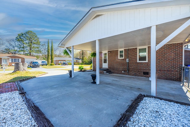 view of patio featuring entry steps and an attached carport