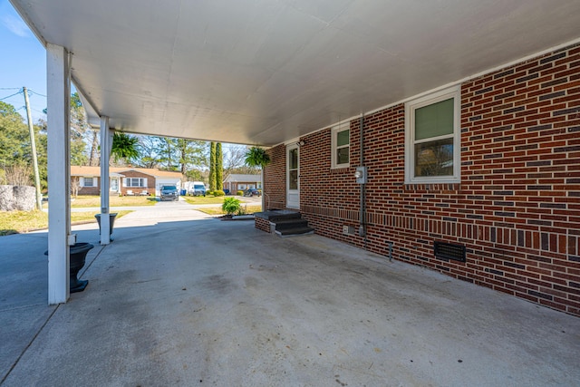 view of patio / terrace featuring entry steps and a carport