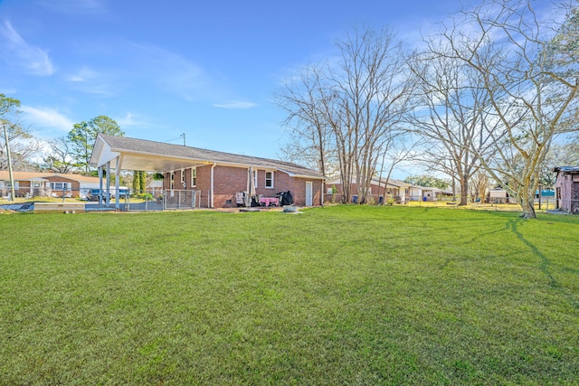 view of yard with a carport