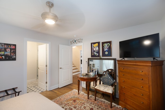 bedroom featuring light hardwood / wood-style floors and ceiling fan