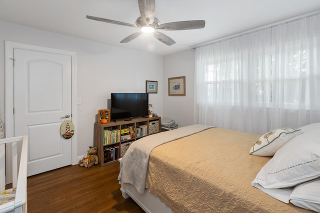 bedroom featuring ceiling fan and dark hardwood / wood-style flooring