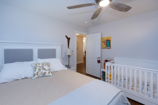 bedroom featuring dark hardwood / wood-style flooring and ceiling fan