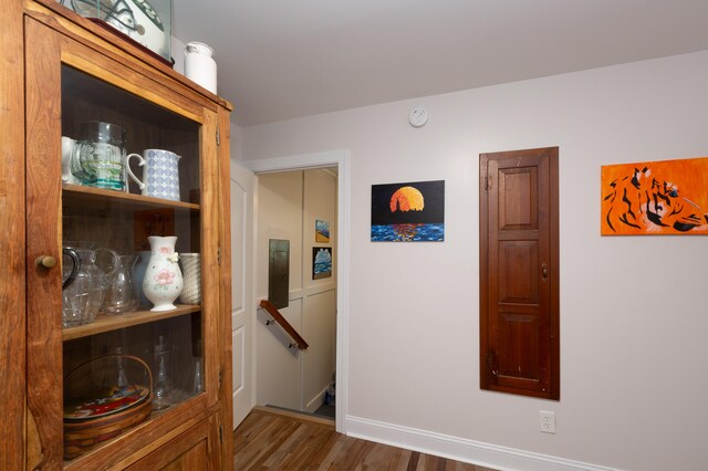 corridor featuring hardwood / wood-style flooring