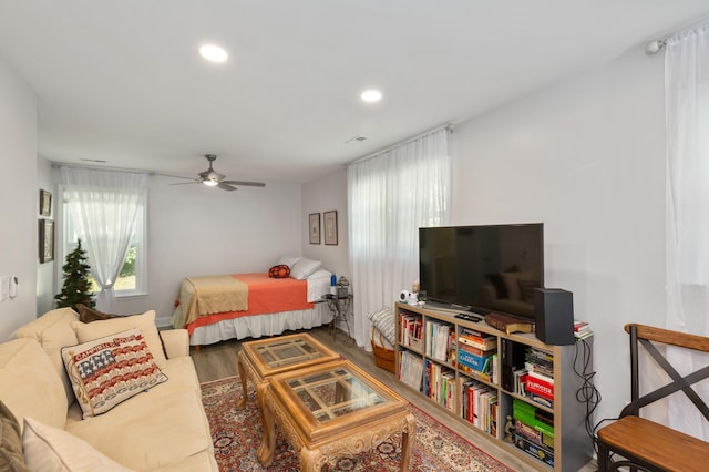 bedroom with hardwood / wood-style floors and ceiling fan