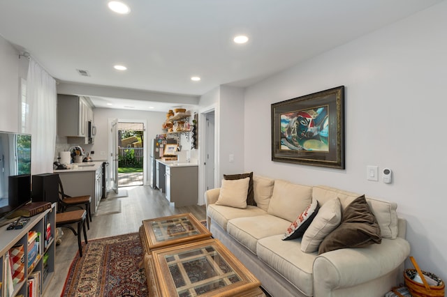 living room with light hardwood / wood-style flooring