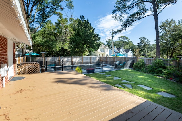 wooden terrace with a yard