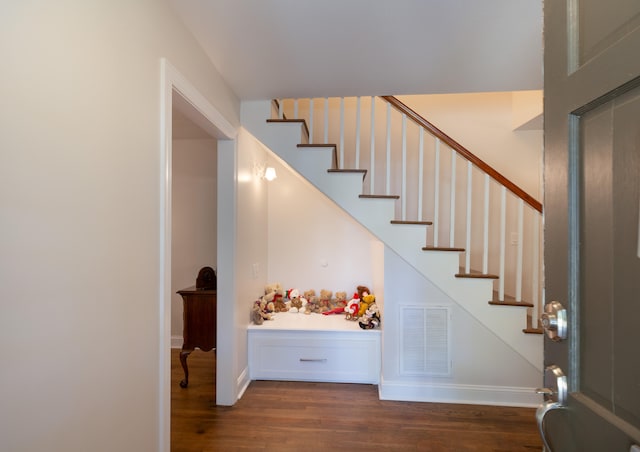 stairs with hardwood / wood-style flooring