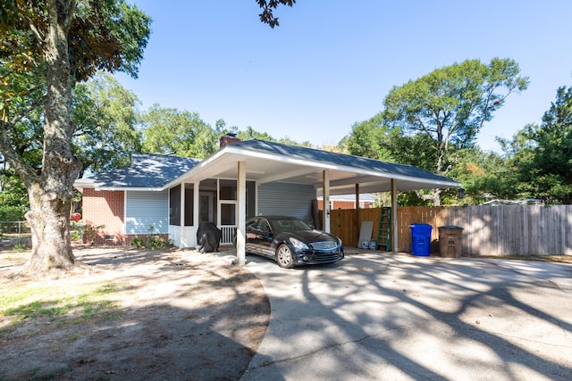 view of front of property featuring a carport