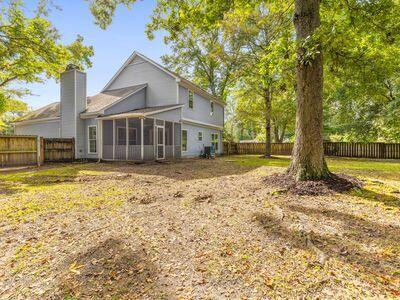 back of house featuring a sunroom