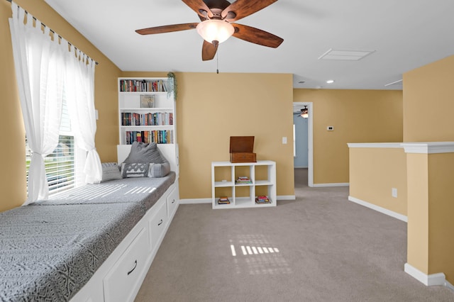 interior space with ceiling fan and light colored carpet