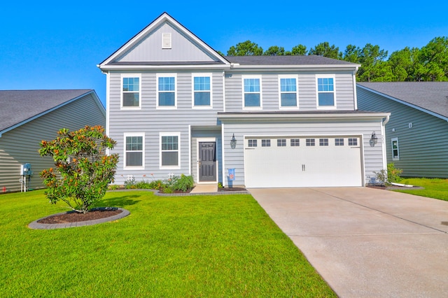 view of front of house featuring a garage and a front yard