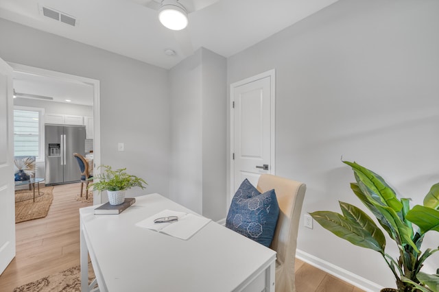 office featuring light hardwood / wood-style flooring and ceiling fan