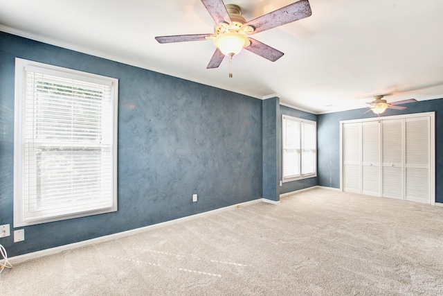 1541 Diamond Blvd, Mount Pleasant, SC 29466 - unfurnished bedroom with baseboards, multiple windows, carpet, and a closet