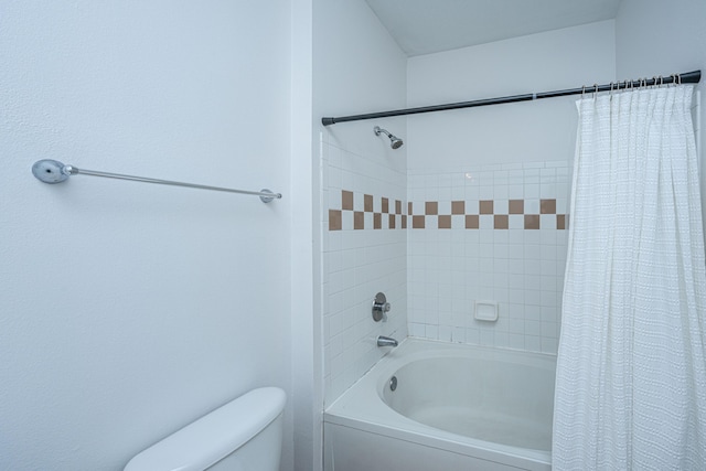 bathroom with toilet and shower / bath combo