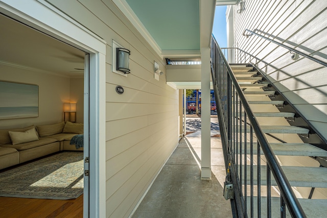 interior space featuring ornamental molding and concrete flooring