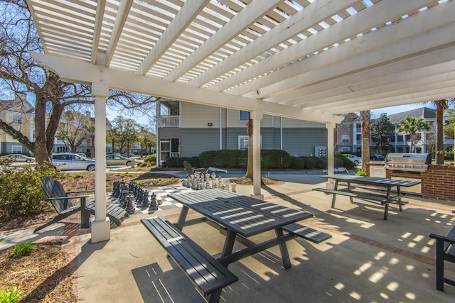 view of patio / terrace with a pergola, a grill, and area for grilling