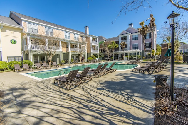 view of swimming pool featuring a pergola and a patio area