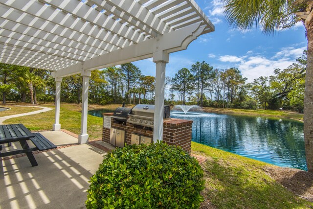 view of patio / terrace featuring area for grilling, a grill, a water view, and a pergola