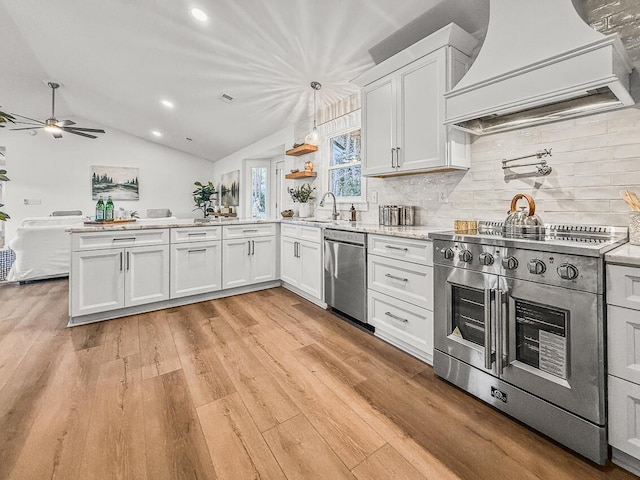 kitchen with custom exhaust hood, appliances with stainless steel finishes, pendant lighting, and white cabinets