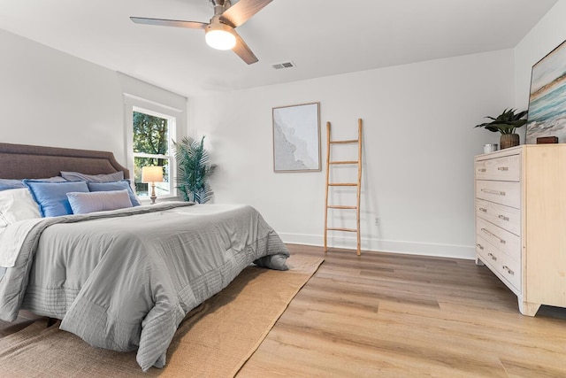 bedroom with wood-type flooring and ceiling fan