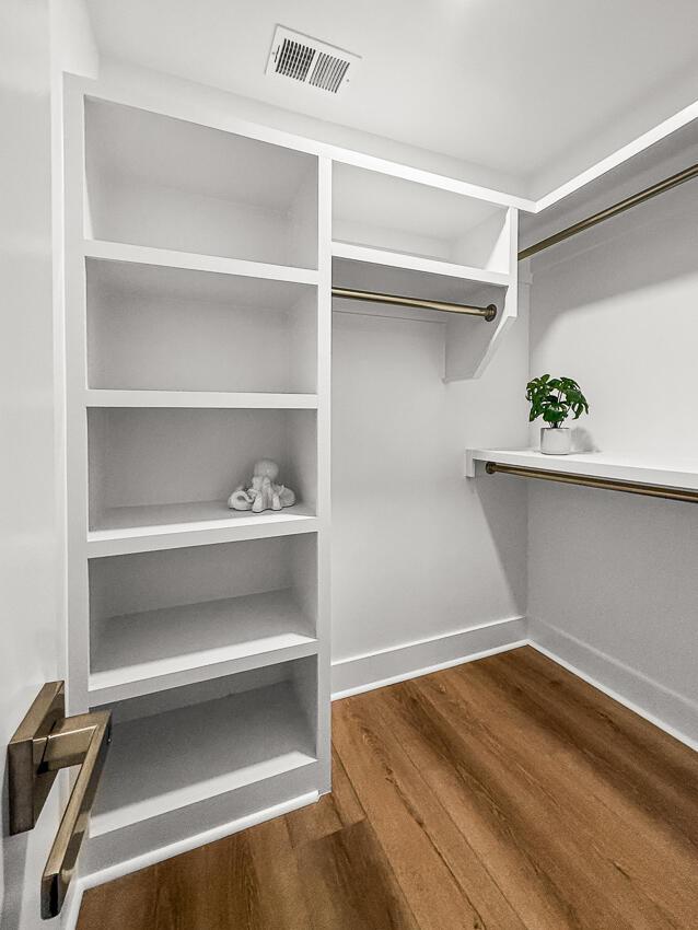 spacious closet featuring hardwood / wood-style floors