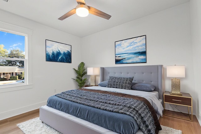 bedroom with wood-type flooring and ceiling fan