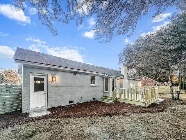 rear view of property with a wooden deck