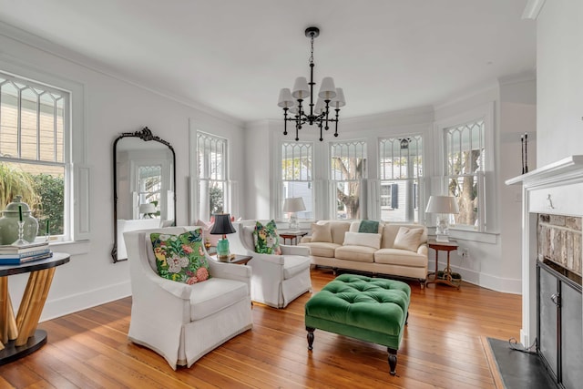 sunroom / solarium featuring a fireplace with flush hearth and a notable chandelier