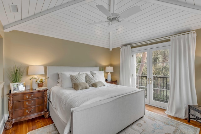 bedroom featuring french doors, visible vents, wood ceiling, wood finished floors, and access to outside