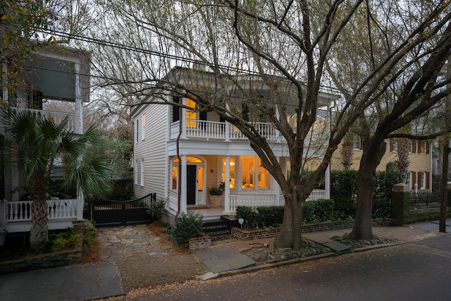 view of front of house featuring a balcony