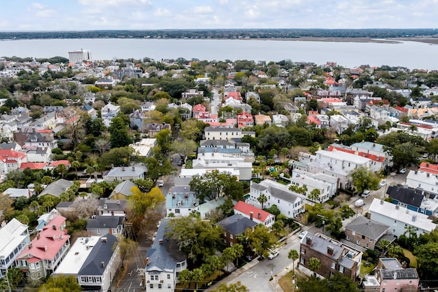 birds eye view of property with a water view and a residential view