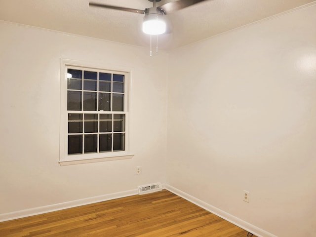 empty room with ceiling fan and wood-type flooring