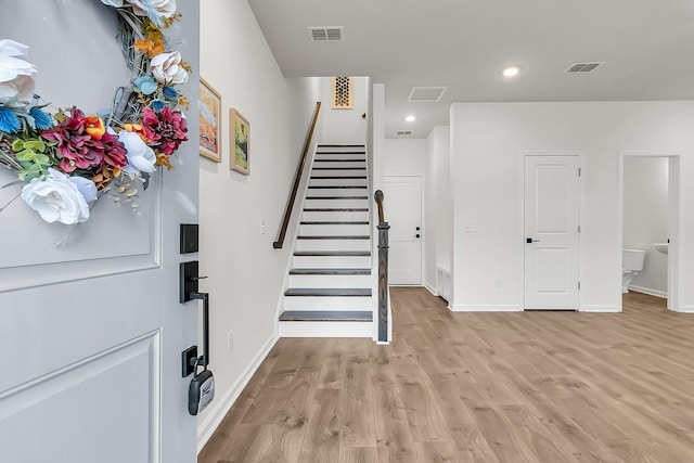 foyer entrance with light hardwood / wood-style flooring