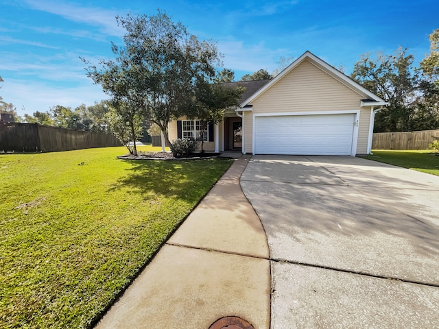 view of front of property featuring a front lawn and a garage