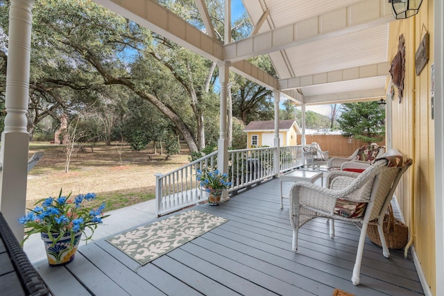 deck featuring a shed