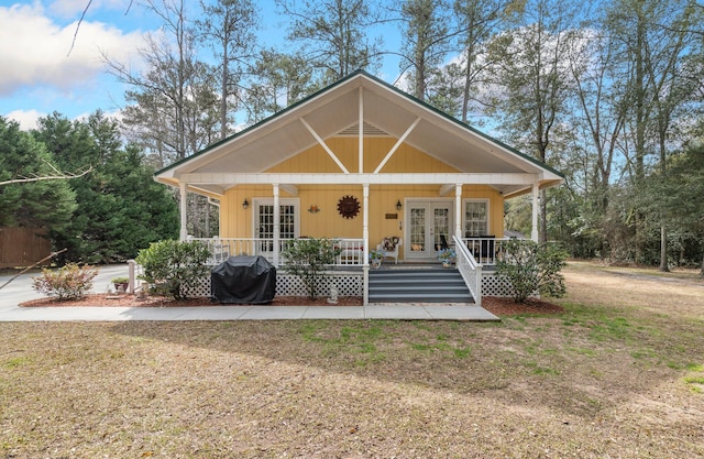 view of front of property featuring french doors and a porch