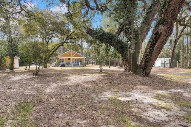 view of yard with covered porch