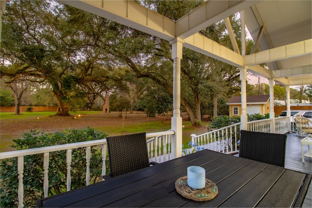 wooden terrace with an outbuilding