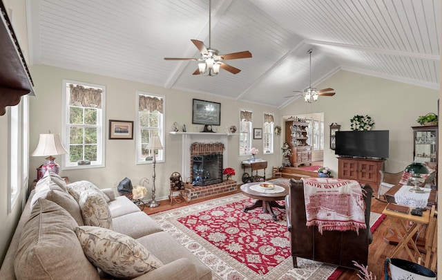 living room featuring a fireplace, wood-type flooring, and lofted ceiling