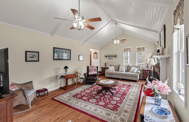 living room with high vaulted ceiling and hardwood / wood-style floors