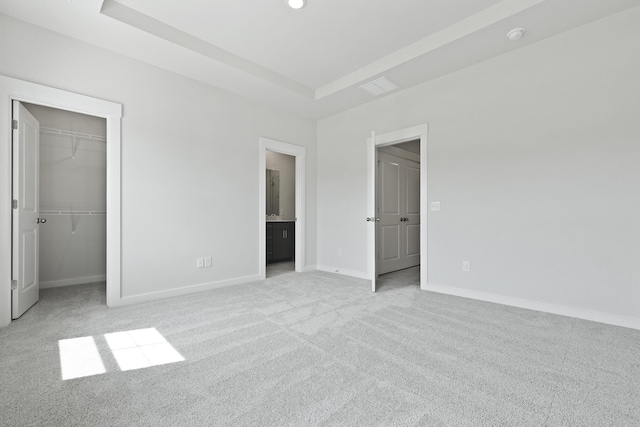 564 Scholar Way, Summerville, SC 29486 - unfurnished bedroom featuring carpet floors, a walk in closet, a raised ceiling, a closet, and ensuite bath
