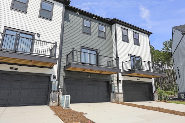 564 Scholar Way, Summerville, SC 29486 - back of house featuring a balcony, a garage, and driveway