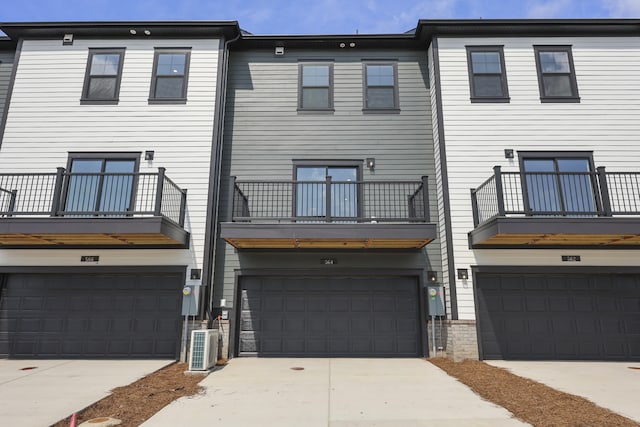 564 Scholar Way, Summerville, SC 29486 - back of property featuring an attached garage, concrete driveway, and a balcony